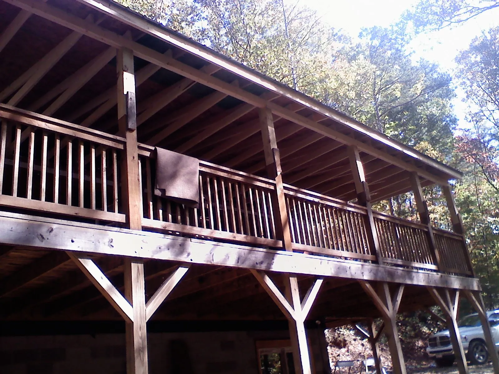 Timber framing under a new elevated porch and deck — Roof Leak Repair in Holland Patent by Roofing Brothers